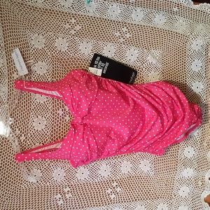 Pink poked dotted one piece bathing suit.